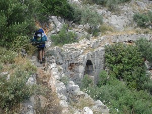 Hiker crossing the Roman bridge between Çavdır and Üzümlü